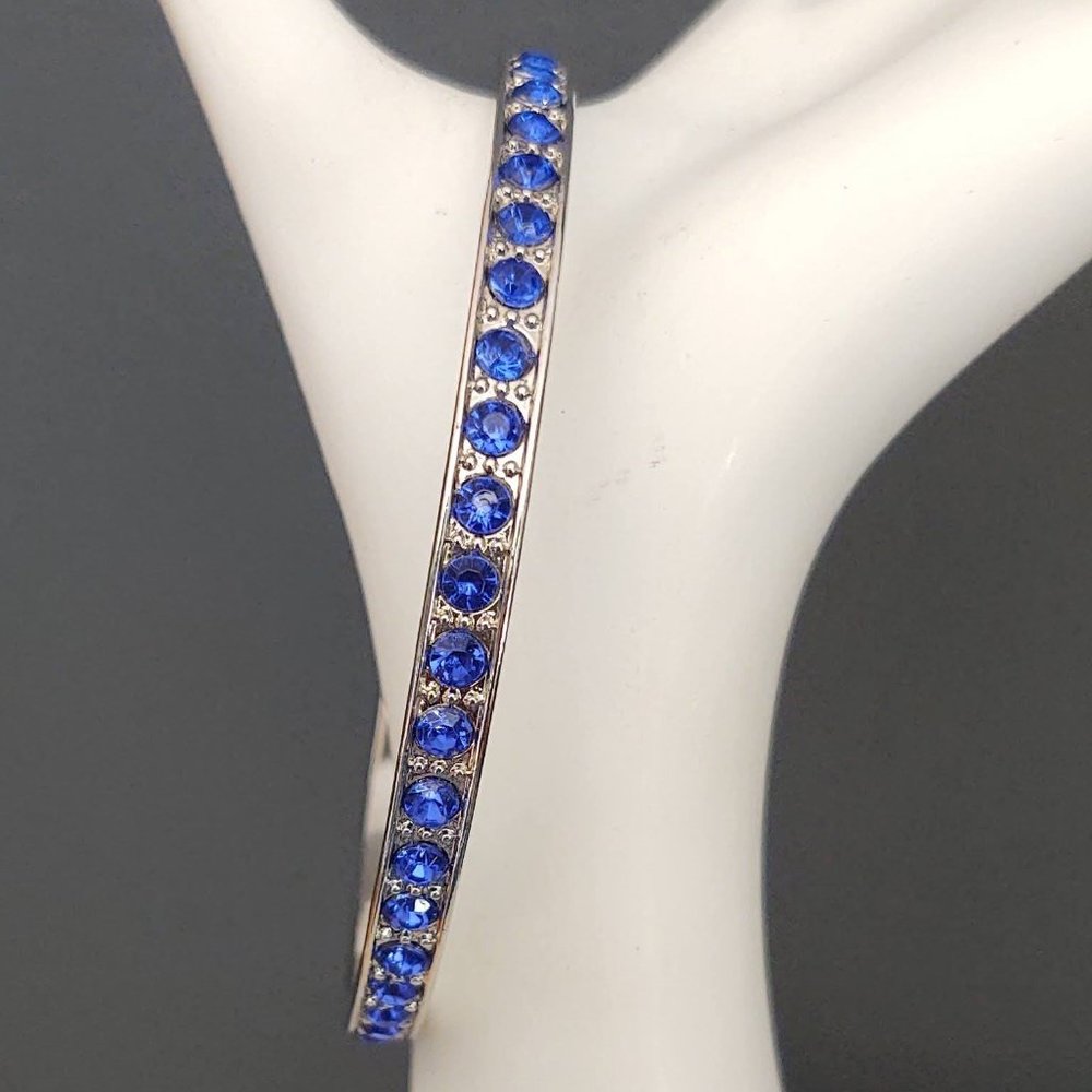 Silver bangle with inlaid blue glass beads